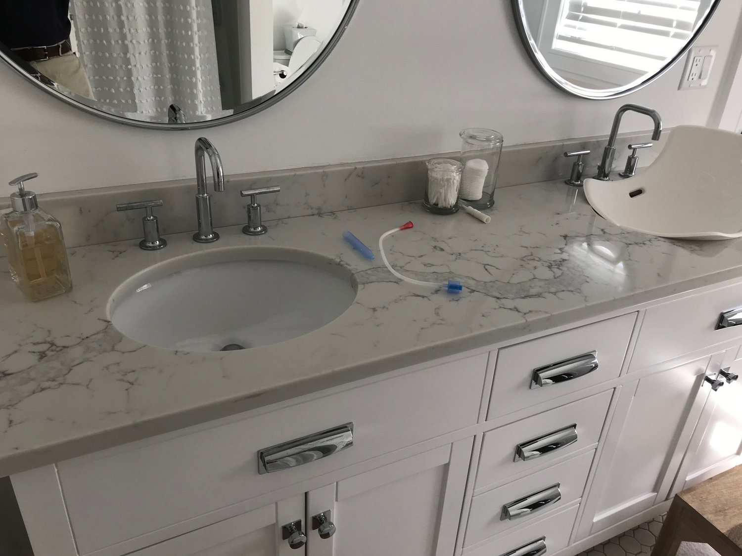 Double-sink quartz vanity top with marble-look veining by Pistritto Marble Imports in Hartford, CT